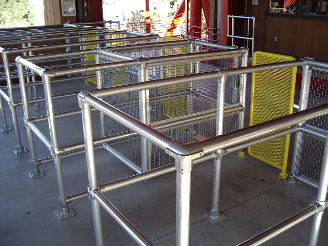 Theme park queue rail